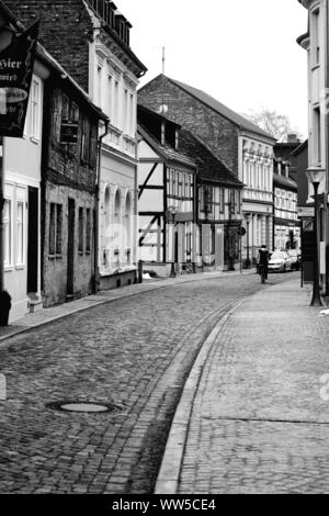 A side street with striking half-timbered houses of the town of Stendal, Stock Photo
