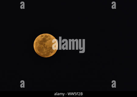 Full moon in a black sky Stock Photo