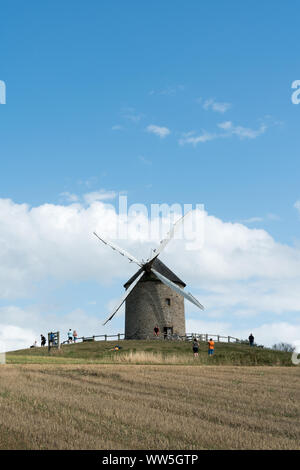 Pontorson, Manche / France - 18 August 2019: tourists visit the famous and historic Moidrey Windmill near Le Mont Saint-Michel in France Stock Photo
