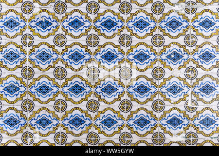 close-up of the pattern of old decorative tiles called azulejos on the building exterior facade in Lisbon, Portugal Stock Photo