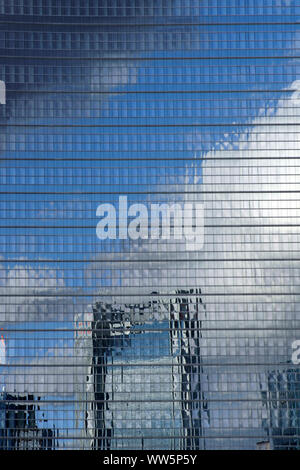 Photography of an abstract high rise facade with the reflection of a skyline and clouds, Stock Photo