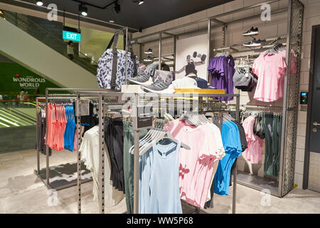 SINGAPORE CIRCA APRIL, 2019: interior shot of Adidas store in Jewel Changi Airport Stock Photo -