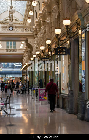 Shopping gallery in central Brussels, Belgium, with visitors browsing shops and cafes Stock Photo