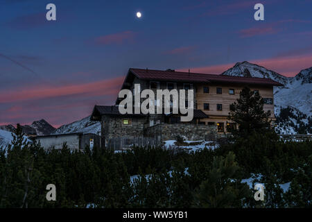 Austria, Tyrol, Sellrain, KÃ¼htai, Dortmund hut in KÃ¼htai with full moon and sundown Stock Photo