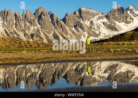 Austria, Tyrol, Grinzens, Salfeins, small boy admiring the impressive KalkkÃ¶gel in the Stubai Alps Stock Photo