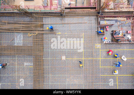 Aerial view of group of construction worker building in construction site. Stock Photo