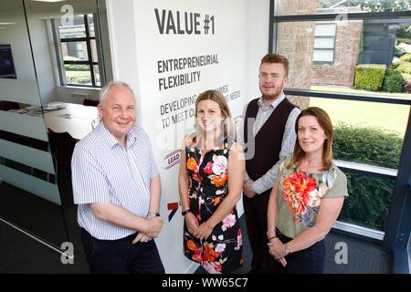 Stewart Barnes, managing director of Quolux, with Jo Draper, director, Keeley Witts, Head of operations, and Bradley Warren, media and marketing assis Stock Photo