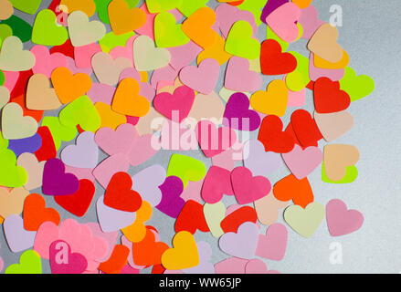 Paper rainbow colors hearts flat lay. Love concept, emotions spectrum and fullness of feelings Stock Photo