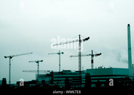 Crane on construction site in the city of Basel, skyline Stock Photo