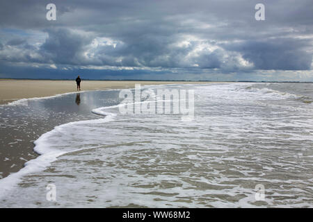 Surf foam on the west beach of the island Langeoog. Stock Photo