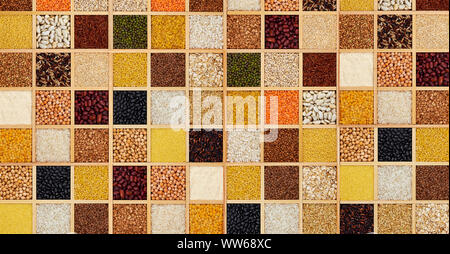 Groats in square wooden box, collection of cereals, beans and seeds, top view Stock Photo