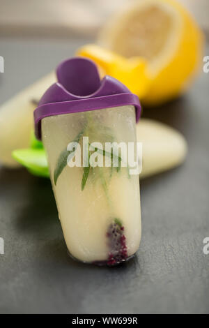 Lemon ice cream with lavender, home-made, slate Stock Photo