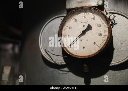 Vintage industrial manometer shows zero pressure, close up photo with soft selective focus Stock Photo