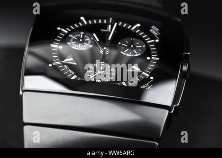 Chronograph, wrist watch made of black high-tech ceramics. Close-up studio photo with selective focus Stock Photo