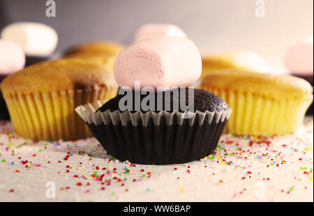Sweet and Delicious Cupcakes with Marshmallows and Sprinkles. Stock Photo
