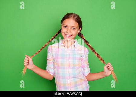 Close up photo small little age she her girl hold hand arm showing tails pigtails positive optimistic nice pretty wear casual checkered plaid shirt Stock Photo