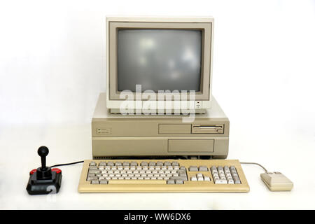Classic Retro PC from the Eighties with Monitor, Mouse and Joystick. Used for Gaming, Writing and Graphics on White. Stock Photo