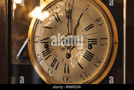 Vintage grandfather clock with white dial. Close up photo Stock Photo