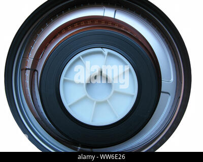 Roll of developed Super 16mm Film Negative on a Bobby in a can on white. 16mm Film is a popular and economical gauge of film stock.