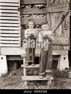 1940s TWO CUTE FARM CHILDREN SMILING SISTER DOUR BROTHER IN BLUE JEANS HOLDING EARS OF CORN ON STEPS TO CRIB LOOKING AT CAMERA - c1403 HAR001 HARS CORN JUVENILE CUTE EARS STYLE TEAMWORK COTTON JOY LIFESTYLE CELEBRATION FEMALES BROTHERS RURAL HOME LIFE UNITED STATES COPY SPACE FRIENDSHIP FULL-LENGTH UNITED STATES OF AMERICA FARMING MALES SIBLINGS CONFIDENCE DENIM SISTERS CRIB AGRICULTURE B&W SADNESS NORTH AMERICA EYE CONTACT NORTH AMERICAN HAPPINESS RUSTIC STRENGTH EXTERIOR FARMERS PRIDE IN OF ON TO SIBLING CONCEPTUAL BLUE JEANS CHARMING GROWTH INFORMAL JUVENILES TOGETHERNESS TWILL YOUNGSTER