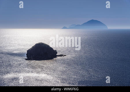 Italy, Sicily, Aeolian Islands, Salina, Pollara, Pollara Bay with Scoglio di Faraglione rocky island towards Filicudi Stock Photo