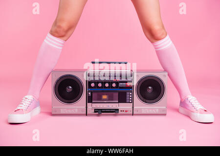 Cropped close up photo skinny perfect ideal she her lady legs opposite standing boom box play between teens hanging out celebrating weekend holiday Stock Photo