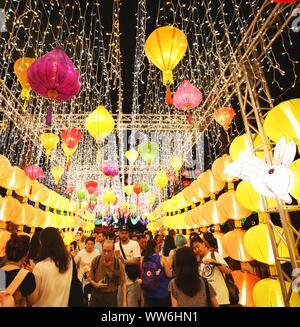 Hong Kong, China. 13th Sep, 2019. People view lanterns at a lantern fair celebrating the Mid-Autumn Festival at Victoria Park in Hong Kong, south China, Sept. 13, 2019. Credit: Lu Ye/Xinhua/Alamy Live News Stock Photo