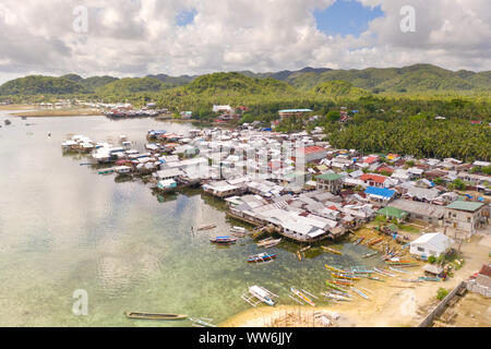 Dapa, Siargao, Philippines. Fishing village with wooden houses, standing on stilts in the sea, top view. Landscape in the Philippines. Stock Photo