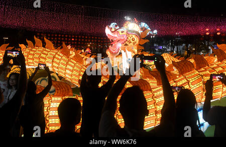 Hong Kong, China. 13th Sep, 2019. People view lanterns at a lantern fair celebrating the Mid-Autumn Festival at Victoria Park in Hong Kong, south China, Sept. 13, 2019. Credit: Lu Hanxin/Xinhua/Alamy Live News Stock Photo