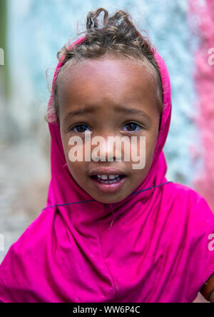 Ethiopian girl with a pink veil and blonde hair, Harari region, Harar, Ethiopia Stock Photo