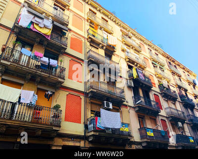 Barcelona / Spain - July 13, 2019: Residential building with Barcelona province flags on it Stock Photo