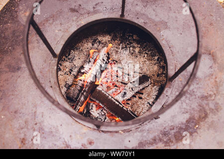 Dirty cast iron cooking grates on 6 burner outdoor gas grill Stock Photo