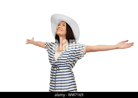 young woman in striped tunic and sun hat Stock Photo