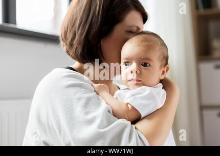 close up of mother holding her baby Stock Photo