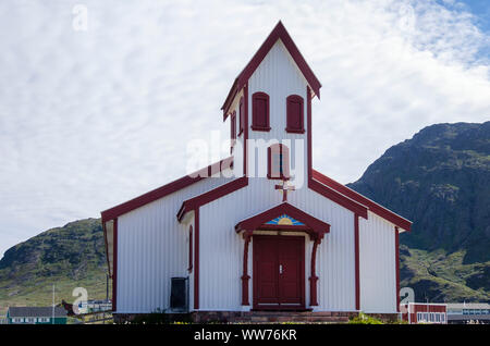 Red and white wooden church designed by local carpenter Pavia Høegh in1927. Narsaq, Kujalleq, South Greenland Stock Photo