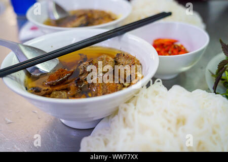 Bun Cha with grilled pork, rice noodles, vegetable and soup in vietnamese cuisine and street foods on VIETNAM HANOI Stock Photo