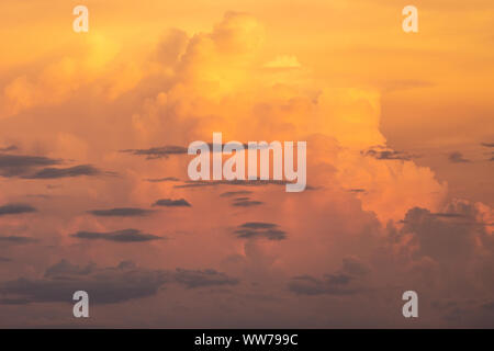 Sunset cumulonimbus clouds illuminated with warm light over the Florida sky. Stock Photo