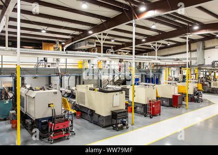 Interior view of a precision manufacturing plant with CNC machines and automation equipment in Brooksville, Florida. Stock Photo