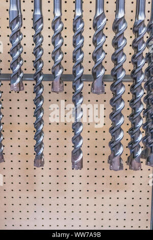 Various sizes of drill bits on display in a hardware store. Stock Photo