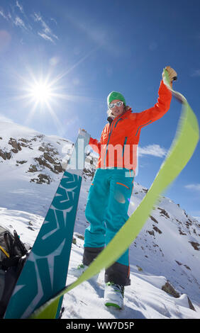 Woman with touring skis on ski tour in KÃ¼htai, Stubai Alps, Tyrol, Austria Stock Photo