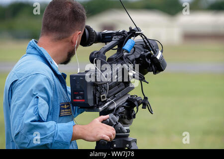 Video Cameraman from the Italian Air Force Frecce Tricolori Records the military aerobatic display team's performance at the RIAT Stock Photo