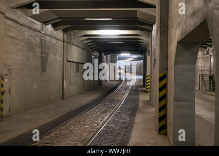 Berlin, Germany. 12th Sep, 2019. Road tunnel with stone pavement and tracks from hangar no. 4 of the former Tempelhof airport. The airport was one of the first commercial airports in Germany and was used in the years after the withdrawal of the U.S. Air Force as a civil commercial airport within Europe and Germany. The listed airport was closed on 30 October 2008. Credit: Soeren Stache/dpa-Zentralbild/ZB/dpa/Alamy Live News Stock Photo