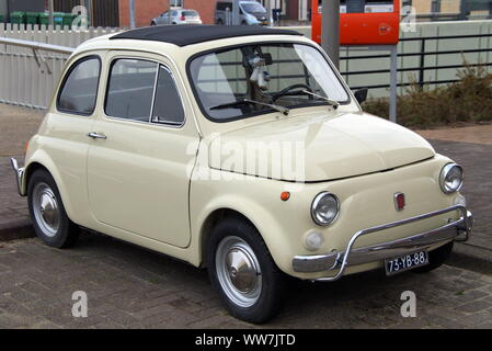 Almere, Flevoland, The Netherlands - November 14, 2014: Beige Fiat 500 parked in a public parking lot. Stock Photo