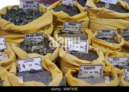 Yellow Bags of Dried Herbs on Display at Forville Covered Market, Cannes, France, EU Stock Photo