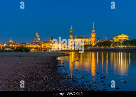 Germany, Saxony, Dresden at night, from the left: Augustus Bridge, academy of arts with dome, Sekundogenitur behind the Church of Our Lady, state house, Italian village behind cathedral St. Trinitatis, Hausmannsturm, Semperoper Stock Photo