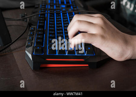 Computer keyboard green illuminated with euro symbol. News Photo - Getty  Images