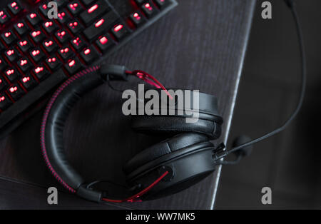 Gamer keyboard with colorful blue lights, modern gamer computer. Blue backlight, backlit on laptop or keyborad computer of gaming. Stock Photo