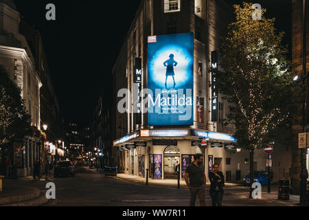 London, United Kingdom - August 31, 2019: Illuminated facade of Cambirdge Theatre located on Seven Dials, London, showing Matilda musical, at night, p Stock Photo