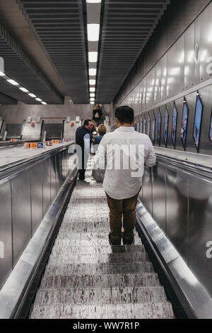 London, UK - August 31, 2019:People on the escalator inside London Underground station, motion blur, selective focus. London Underground is the oldest Stock Photo