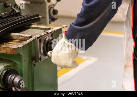 Motswana worker operating a milling machine in a Botswana workshop Stock Photo